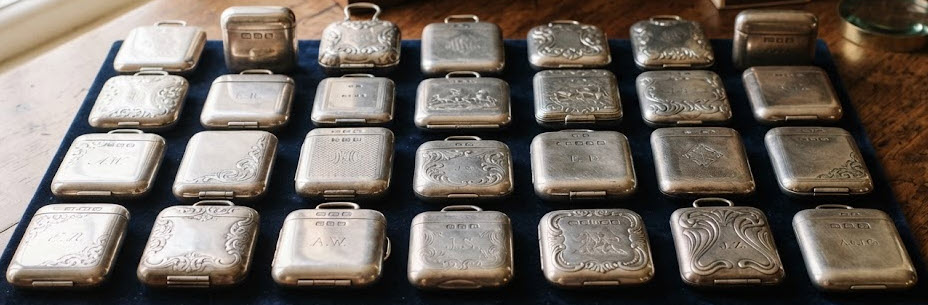 a good collection of English silver vesta cases